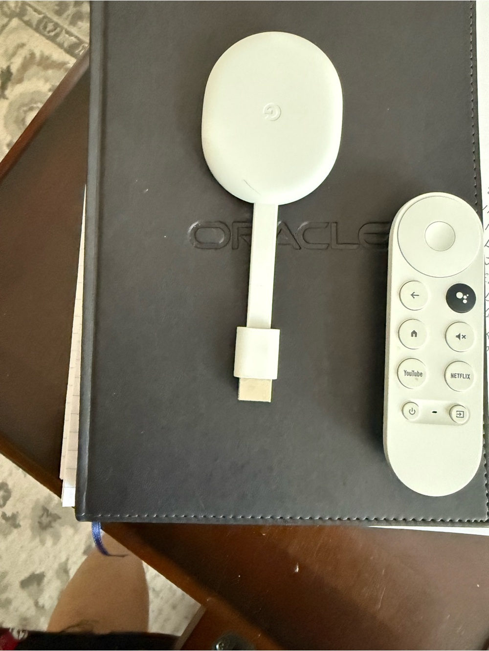 google streaming puck and voice remote in white